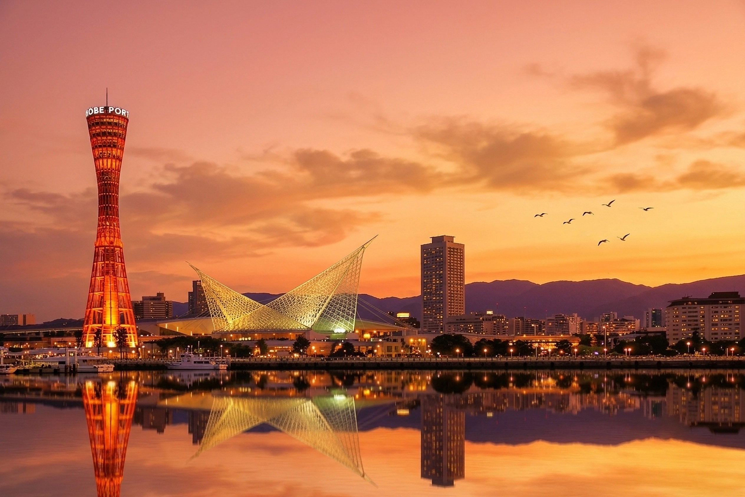 Kobe Port Tower and skyline at sunset - Yetti Kobe Headquarters